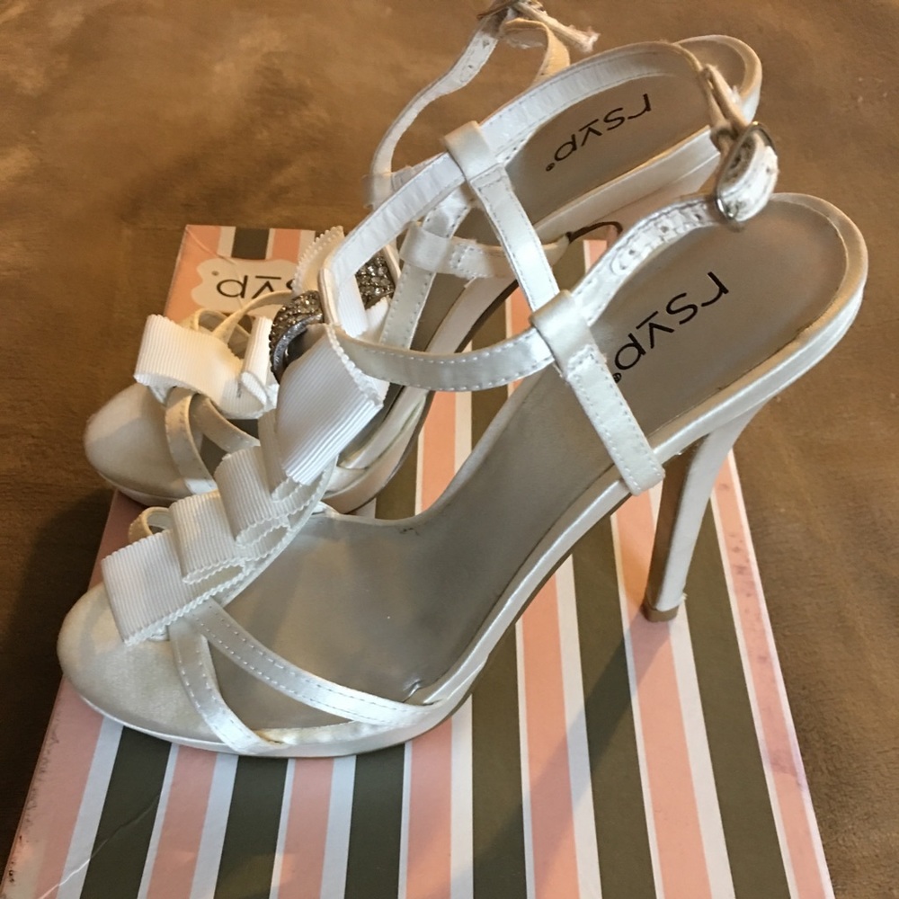 Beautiful white heeled shoes with rhinestones